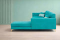 Adorn India Premium Luster 8 Seater L Shape Sofa Set with 2 Puffy & 1 Center Table | Velvet Suede Fabric | 3-Year Warranty | RHS | Aqua Blue with Golden Legs & Striped Pattern Cushion