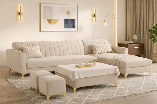 Adorn India Premium Luster 8 Seater L Shape Sofa Set with 2 Puffy & 1 Center Table | Velvet Suede Fabric | 3-Year Warranty | RHS | Cream with Golden Legs & Striped Pattern Cushion